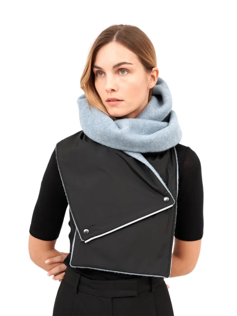 Model wearing a blue hooded scarf made from upcycled fabric with a woven texture.