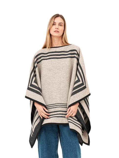 Beige wool reversible poncho with draped silhouette.