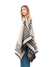 Beige wool reversible poncho with draped silhouette.