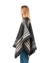 Black wool reversible poncho with a modern look.