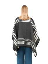 Black and white reversible poncho with a bold black exterior.