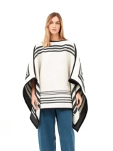 Black and white reversible poncho with a crisp white exterior.