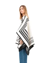 Black and white reversible poncho with a crisp white exterior.