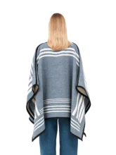 Blue and white reversible poncho with a soft blue exterior.