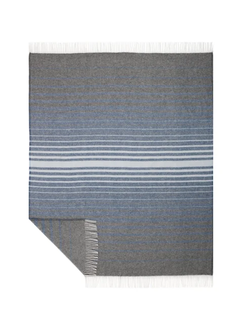 Grey recycled wool blanket with contrasting light and dark stripes, presented flat to showcase its pattern and texture with a clean white fringe.